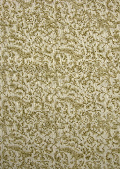 celery green and natural fabric with a small-scale floral block print