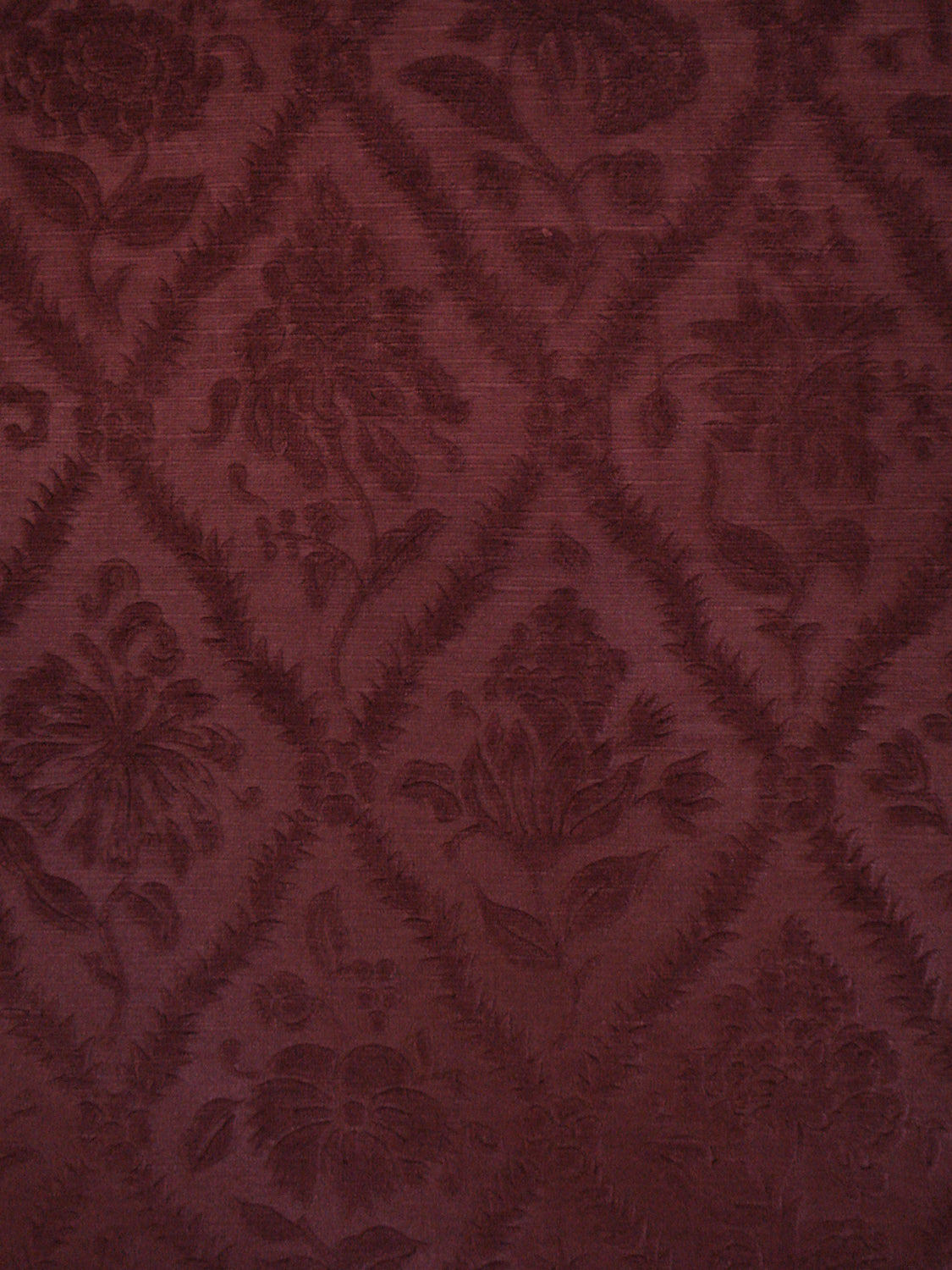 deep burgundy red velvet with a rose and trellis pattern