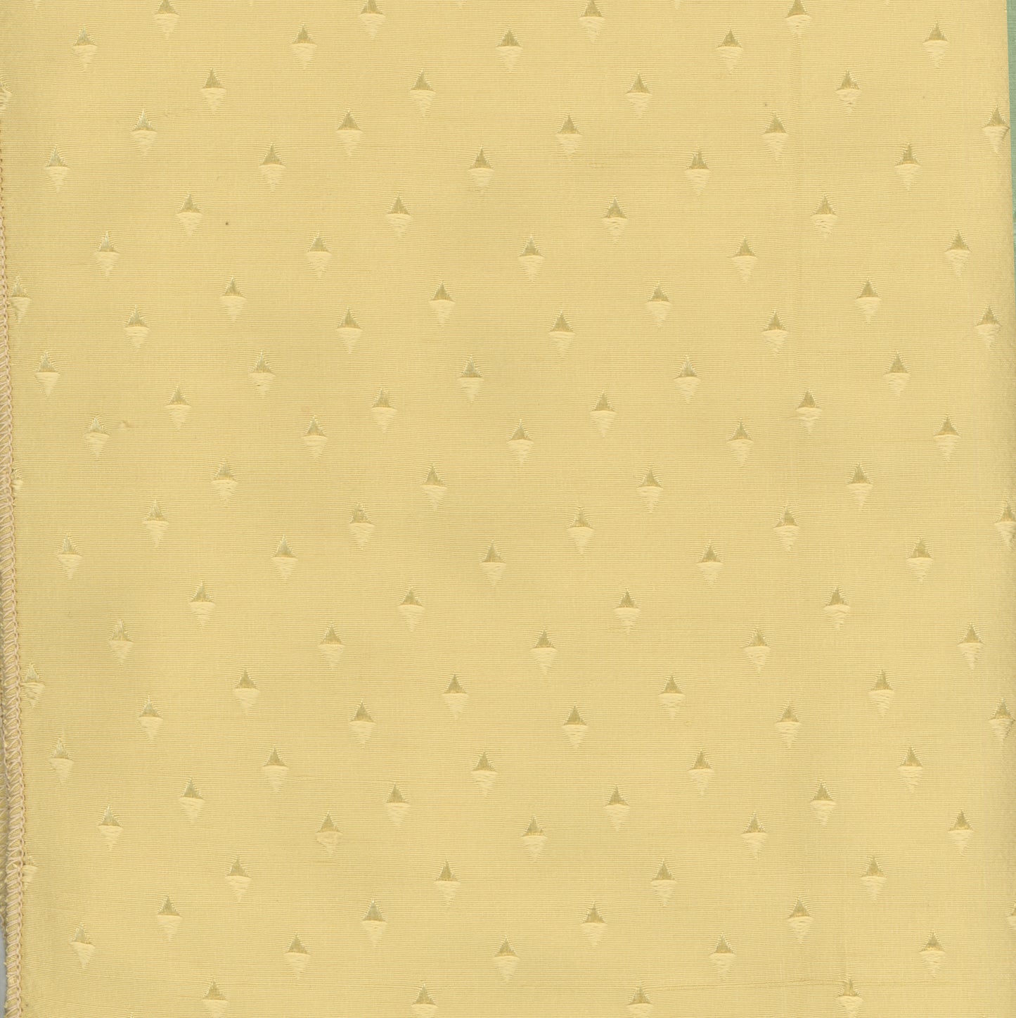 yellow fabric with small woven triangles