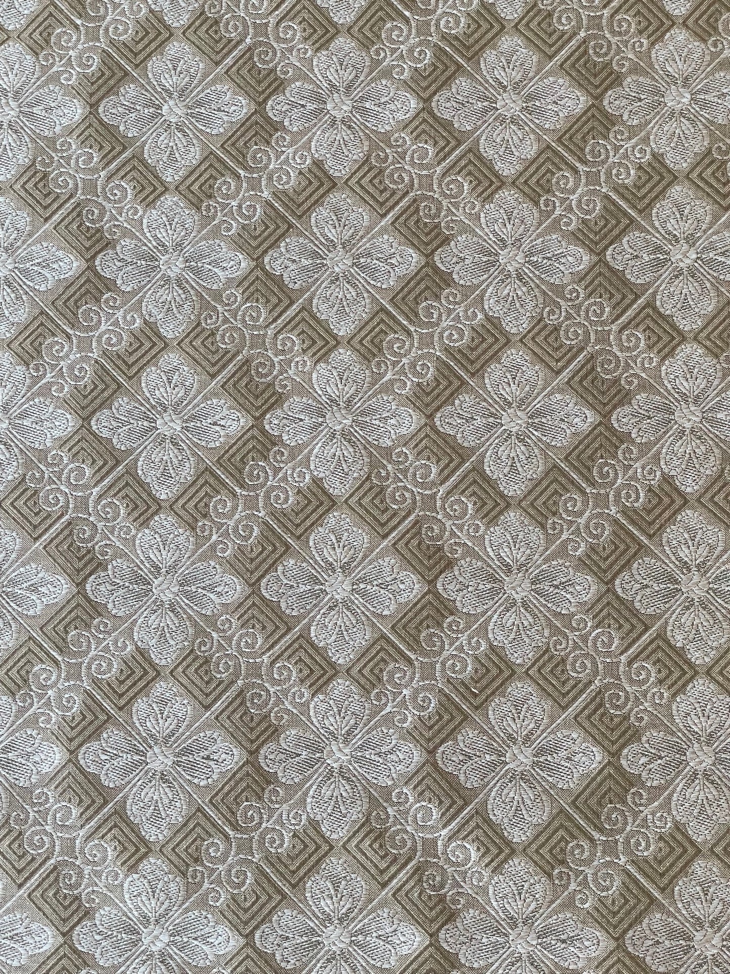 silver and taupe woven fabric with a tiled geometric design