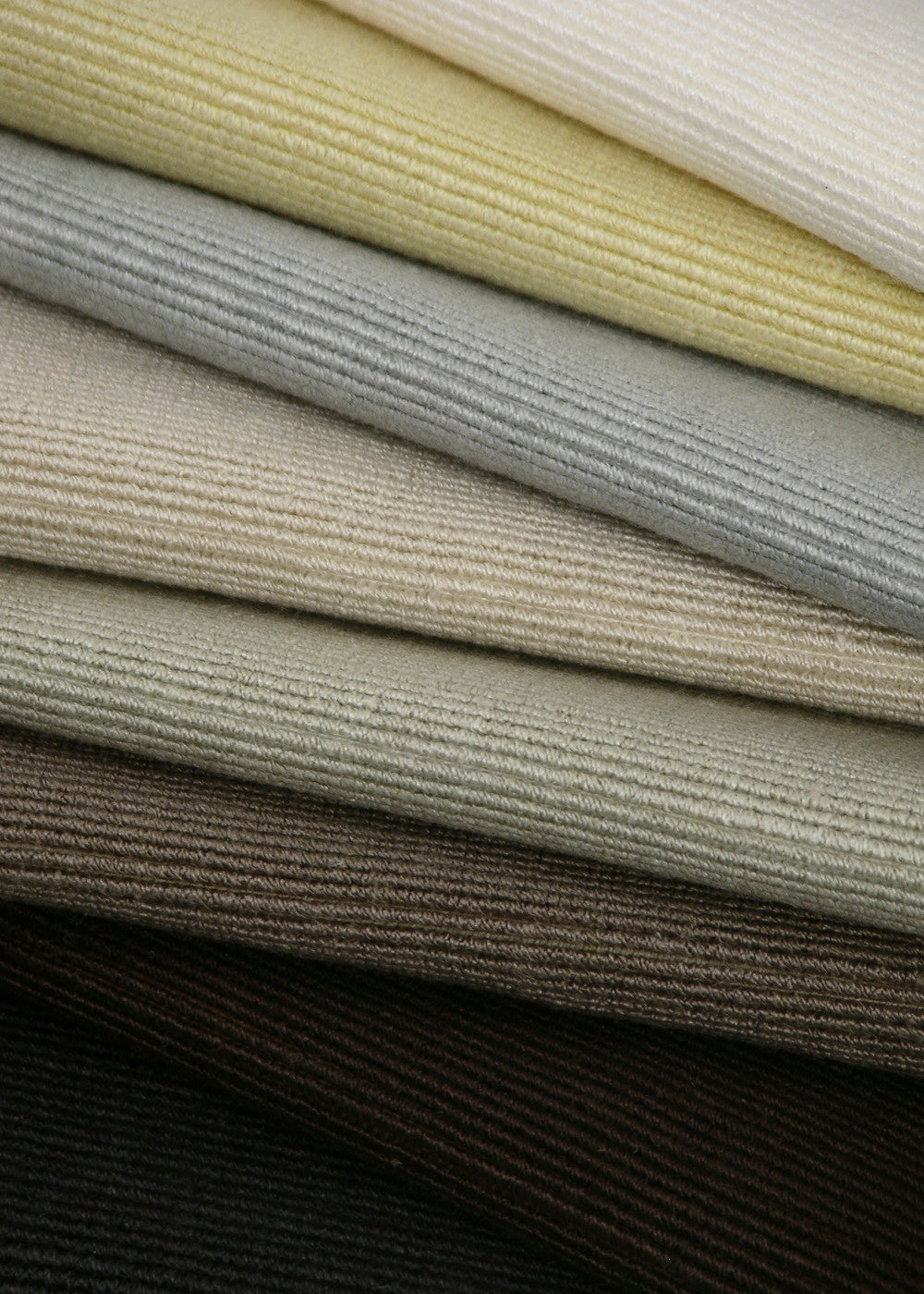 stacked pile of fabrics with a horizontal ribbed texture