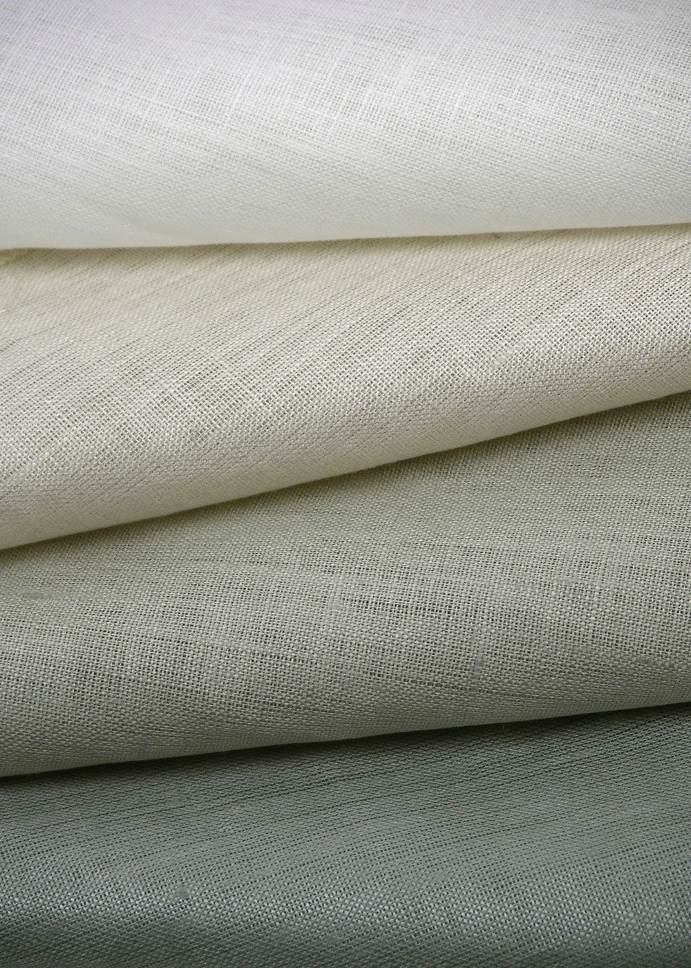 stack of sheer fabric with a luminous finish