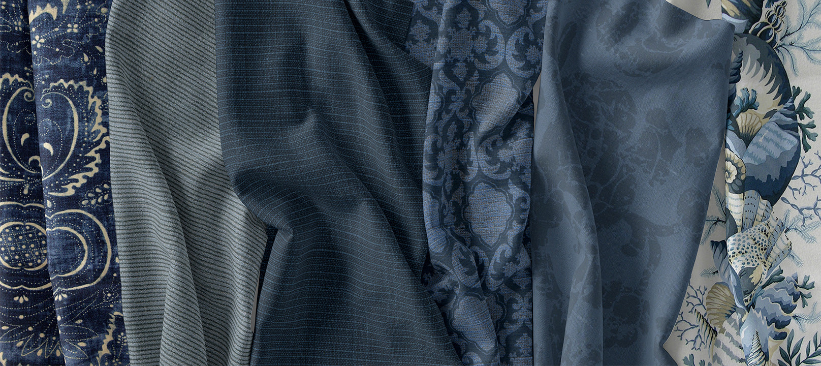 several blue fabrics folded and crumpled