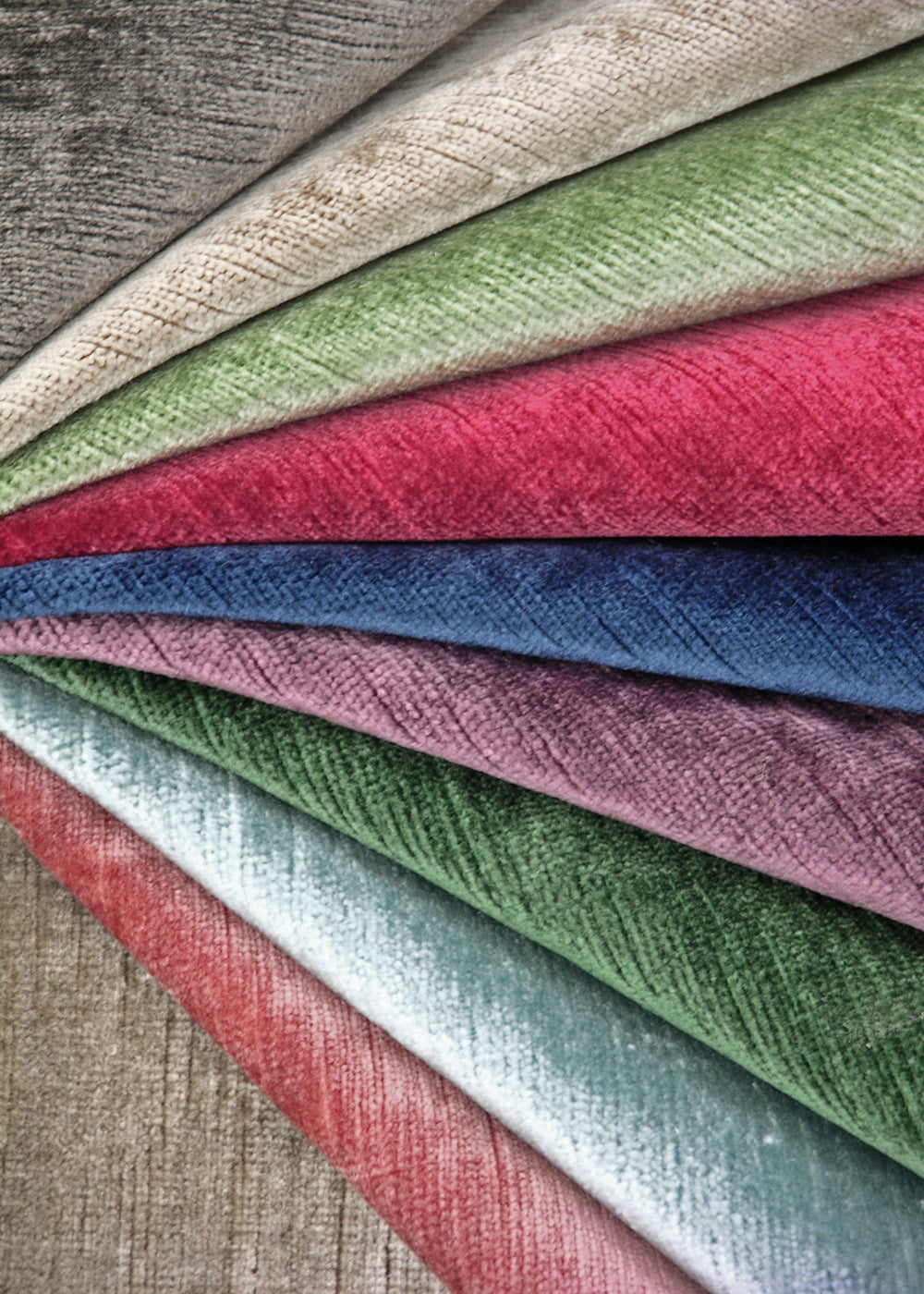 a colorful array of velvet fabrics arranged in a fan shape