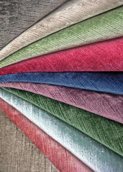 a colorful array of velvet fabrics arranged in a fan shape