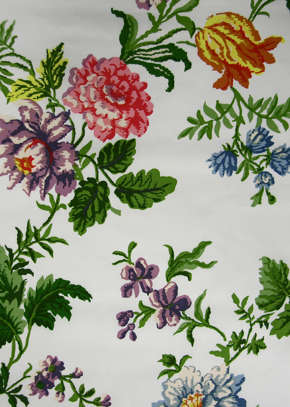 white fabric printed with a sparse but colorful floral print