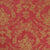 a red fabric with a gold floral damask pattern woven into its design