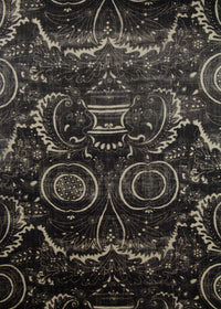 black fabric with a swirly printed pattern