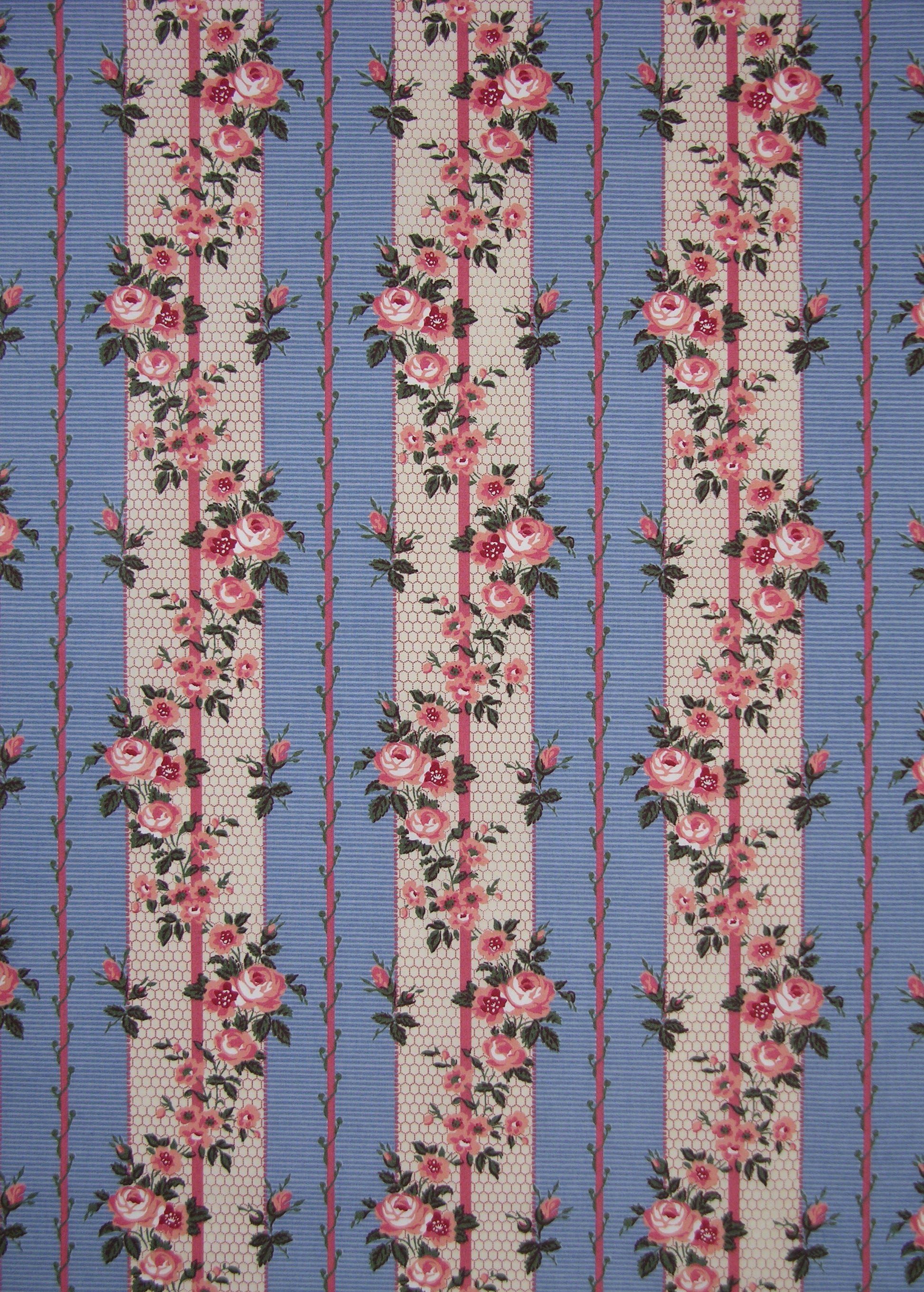 blue striped fabric with printed roses and vines entwining the stripes