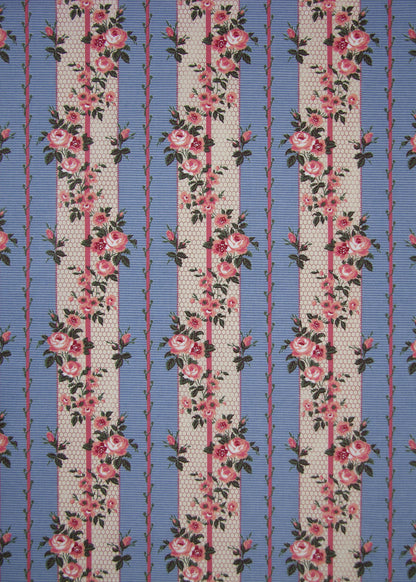 blue striped fabric with printed roses and vines entwining the stripes