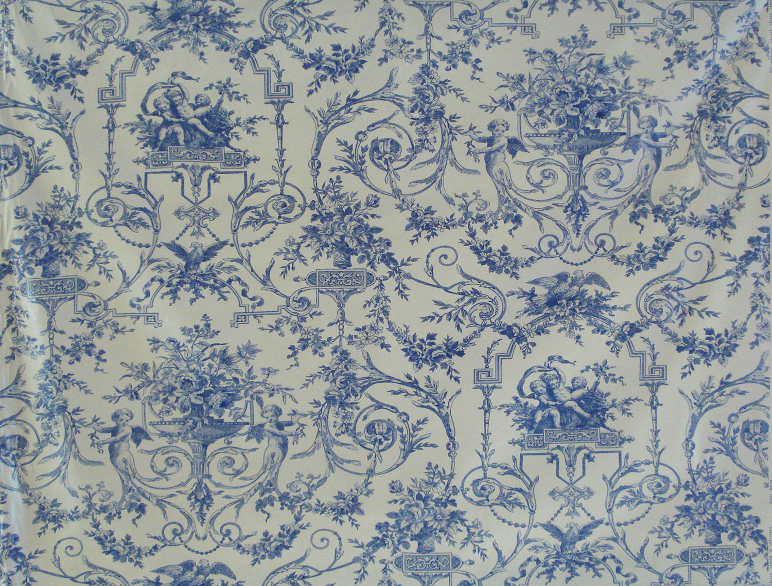 a blue and white vintage toile fabric