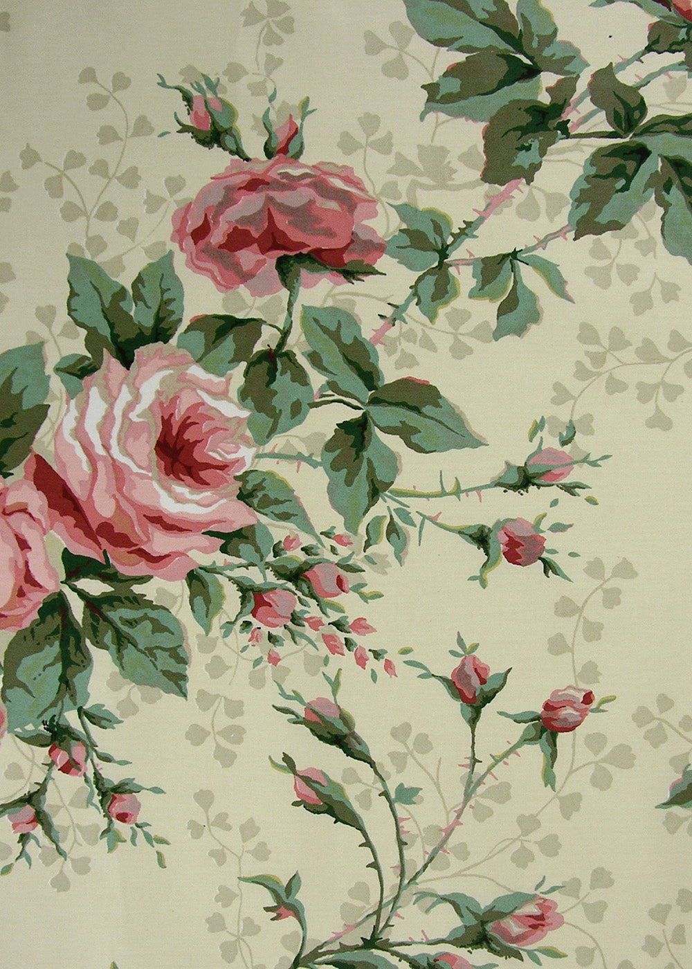 light butter yellow fabric printed with roses, rose buds, and branching vines
