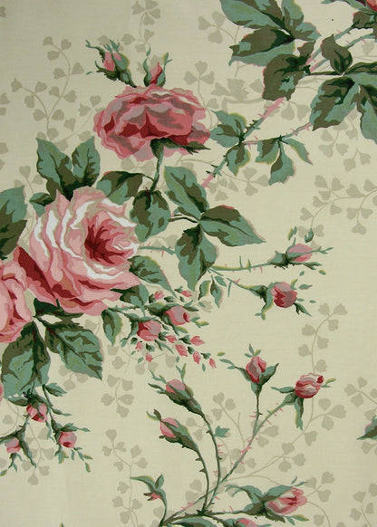 light butter yellow fabric printed with roses, rose buds, and branching vines