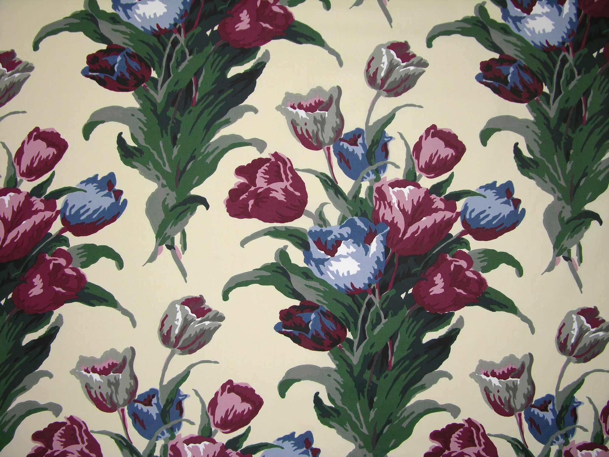 butter yellow fabric with a floral print of magenta and blue tulips on top