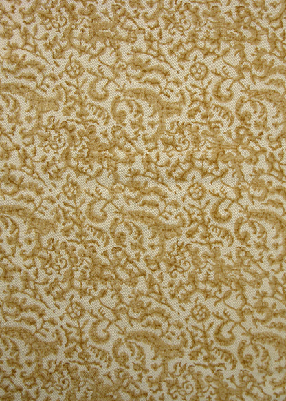 gold and natural fabric with a small-scale floral block print