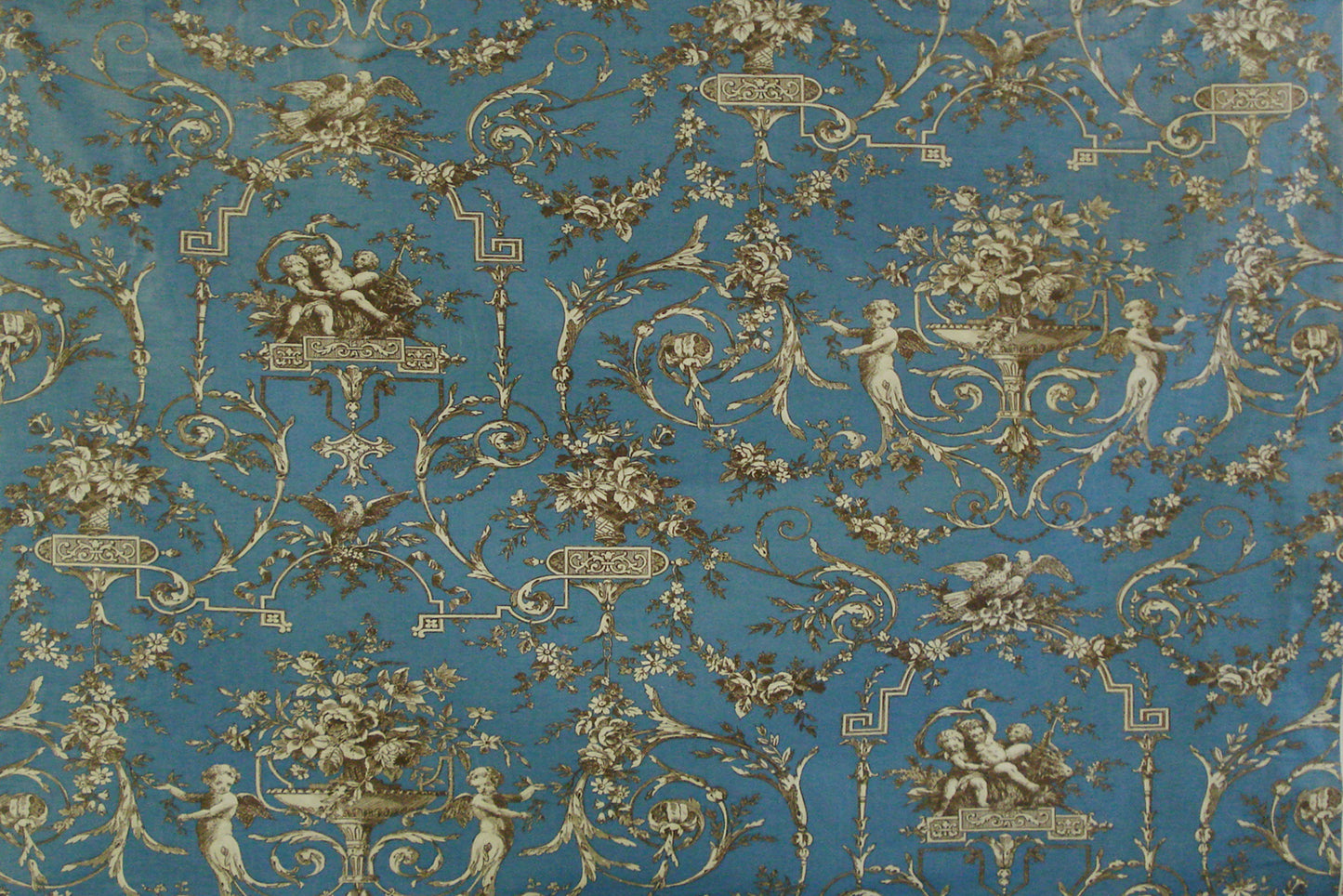 a blue and gold vintage toile fabric