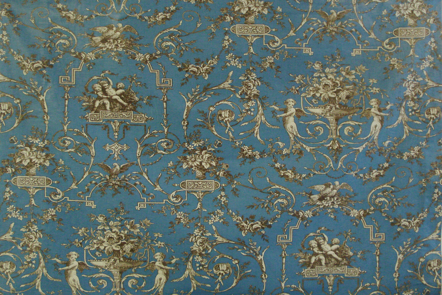 a blue and gold vintage toile fabric