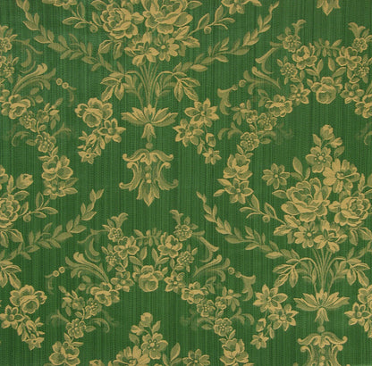 a green fabric with a gold floral damask pattern woven into its design