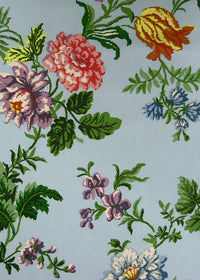 sky blue fabric printed with a sparse but colorful floral print