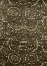 dark olive green fabric with a swirly printed pattern
