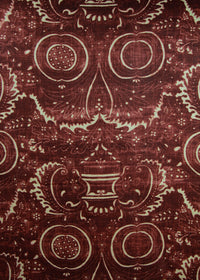 dark red fabric with a swirly printed pattern
