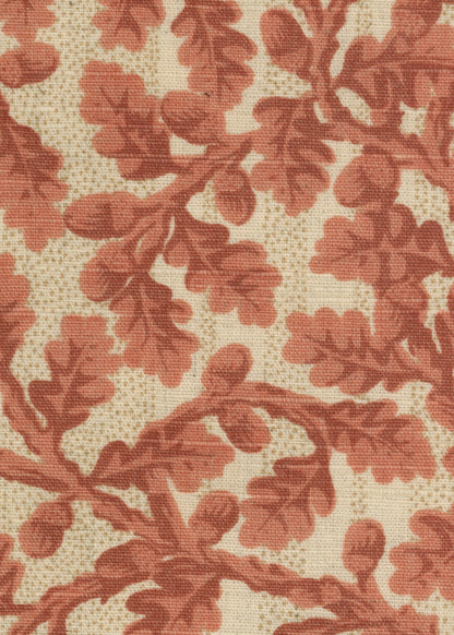 linen fabric printed in soft red with small-scale oak leaves and acorns