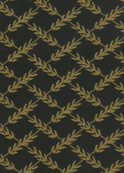 black and gold upholstery fabric with a woven pattern that looks like ears of wheat