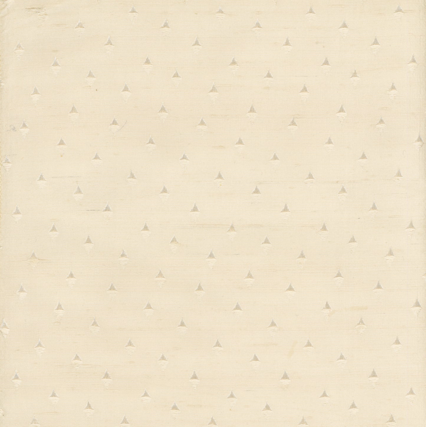 cream colored fabric with small woven triangles