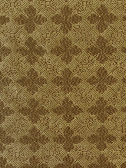 golden and camel woven fabric with a tiled geometric design
