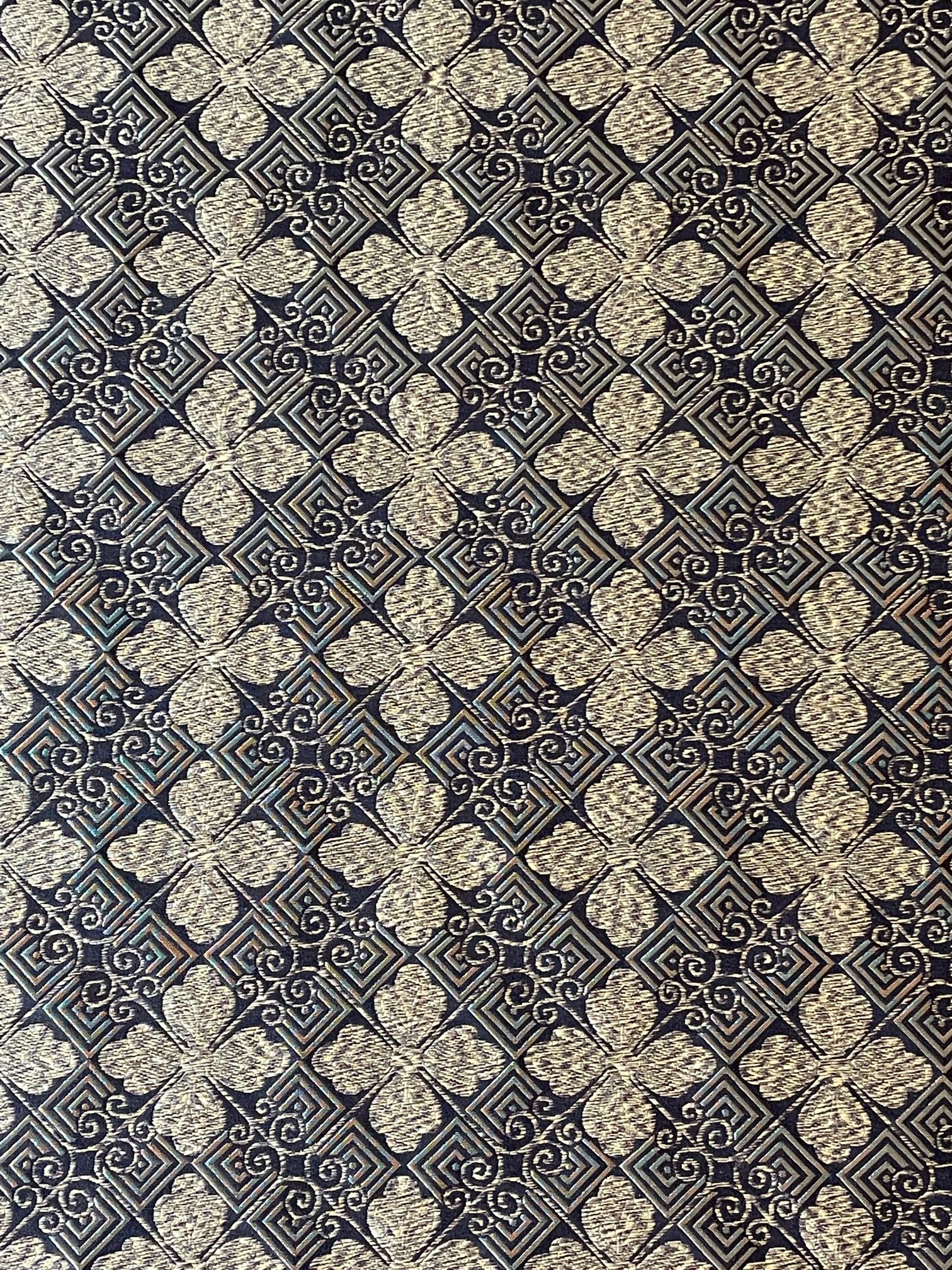 gold and black woven fabric with a tiled geometric design