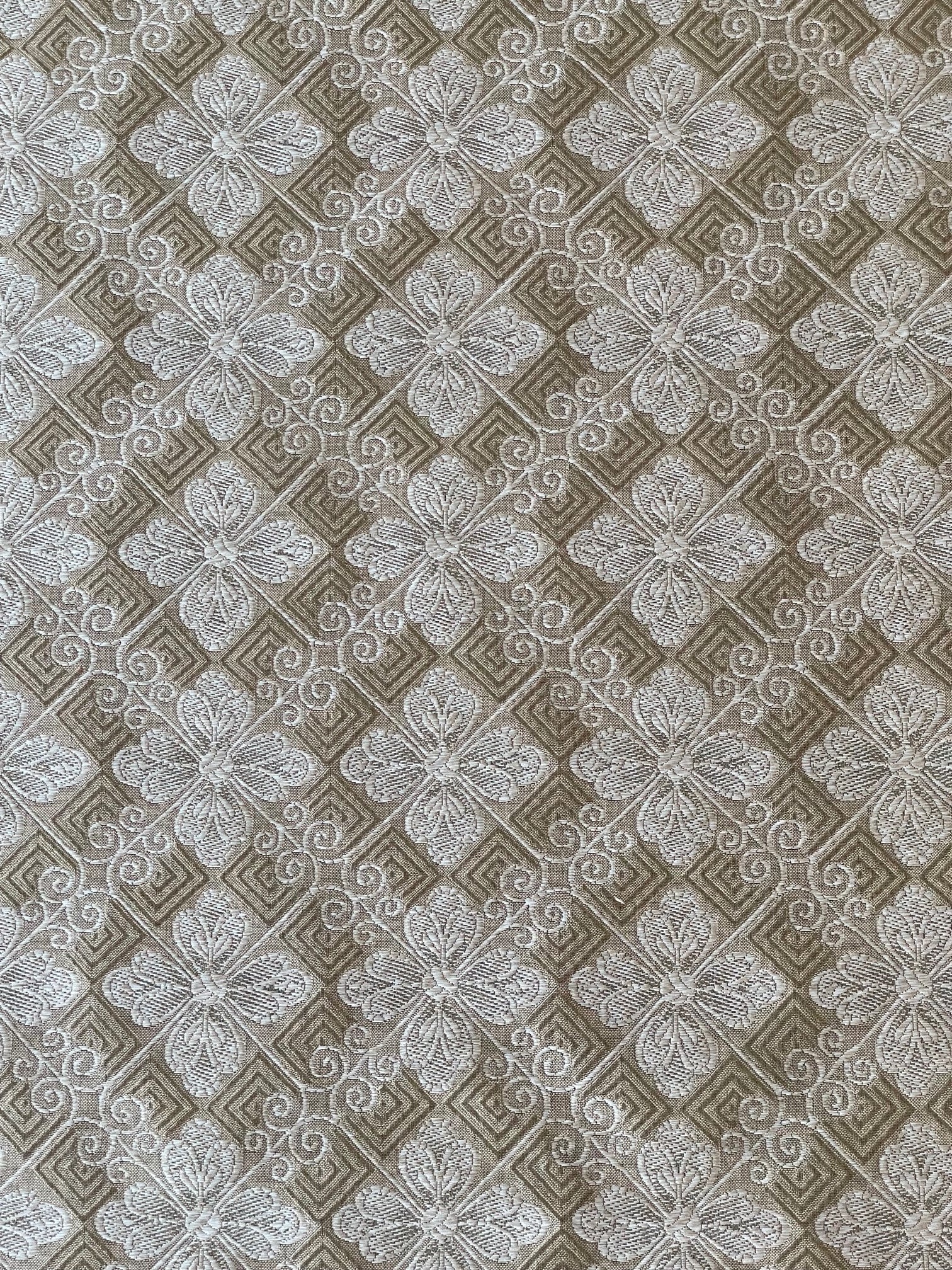 silver and taupe woven fabric with a tiled geometric design