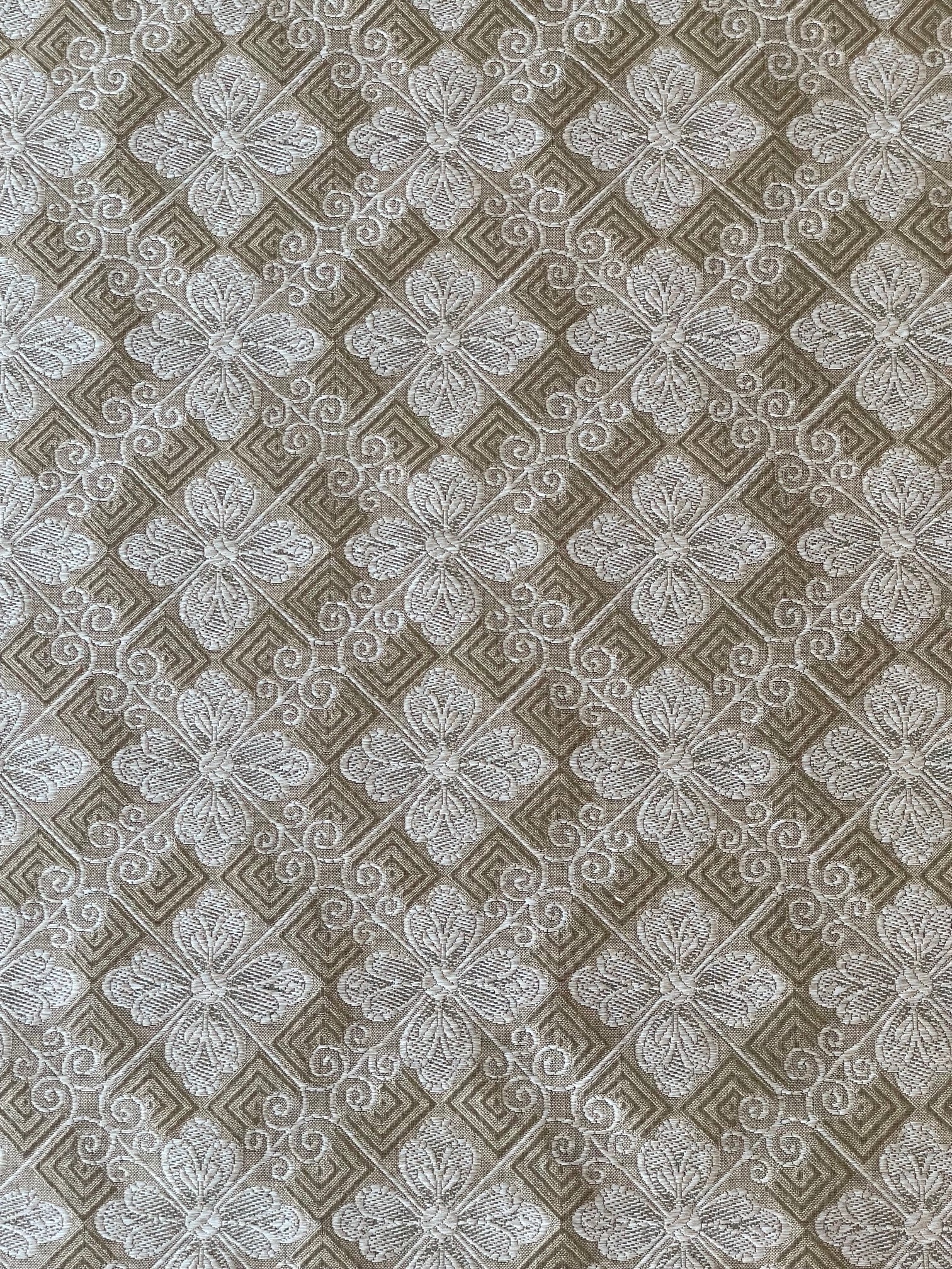 silver and taupe woven fabric with a tiled geometric design