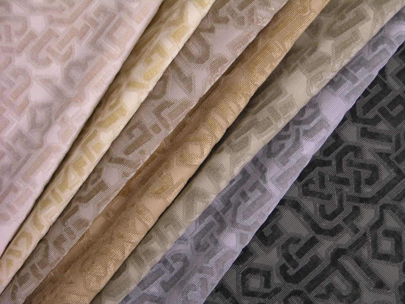 a group of velvet fabrics with a geometric lattice design