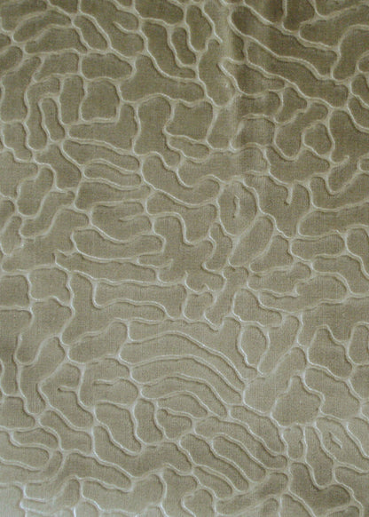 green-gold velvet fabric with organic shaped texture