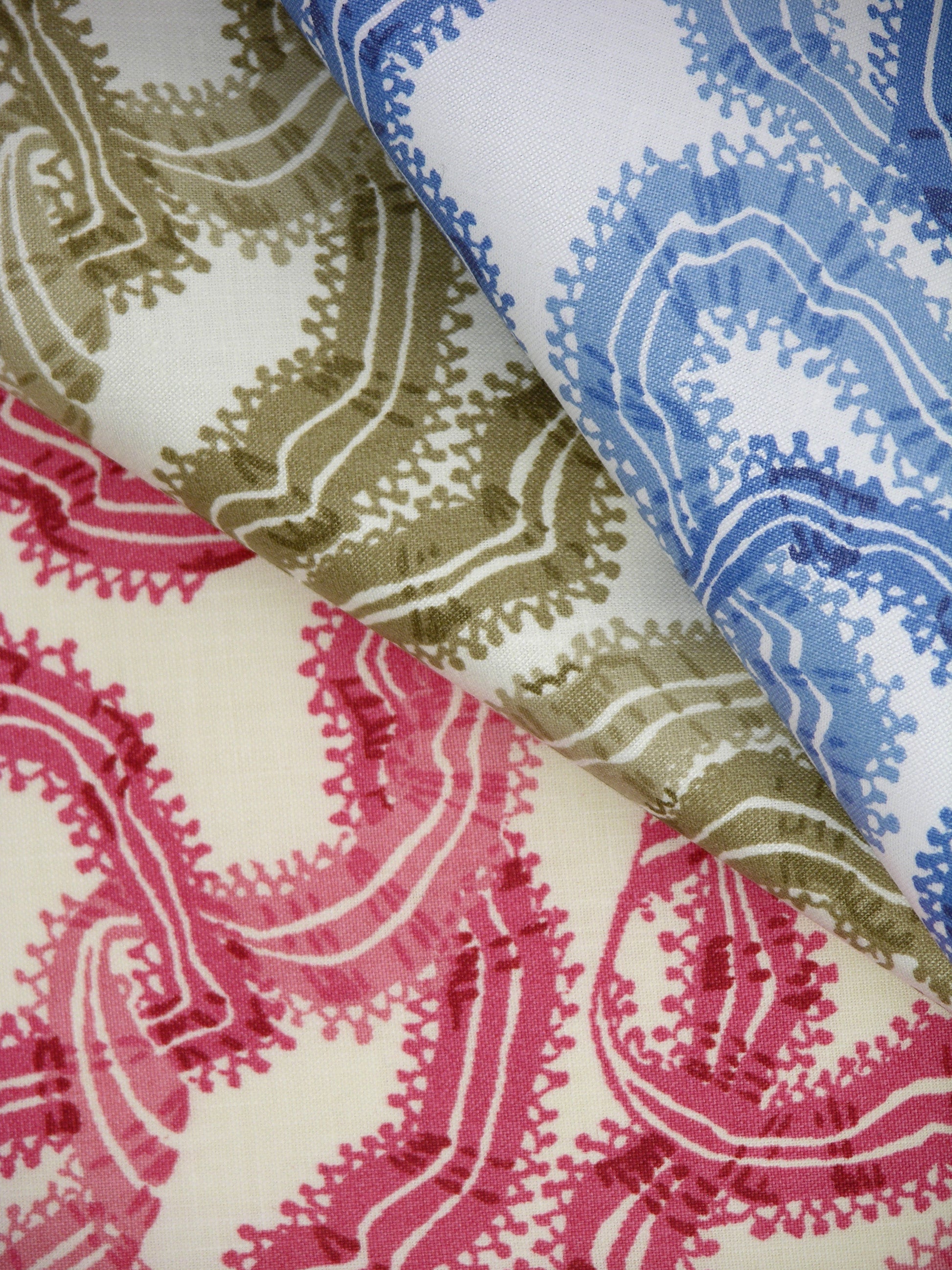 stack of.cotton fabrics printed with colorful ribbons design