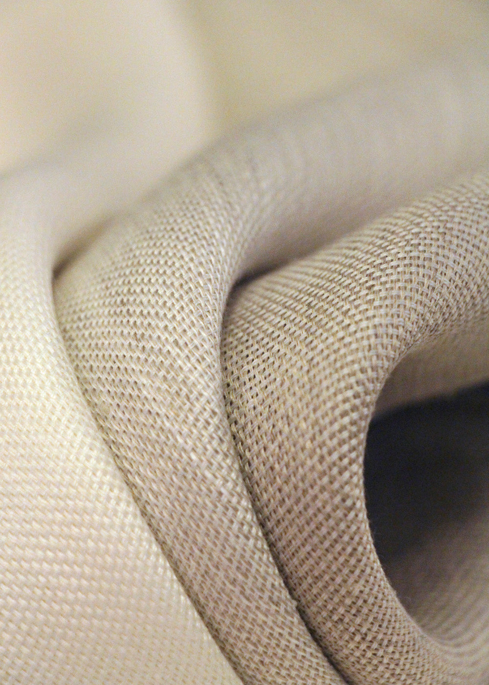 close up of folded linen fabric, shown in three colors