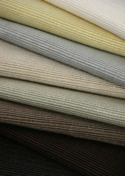 stacked pile of fabrics with a horizontal ribbed texture