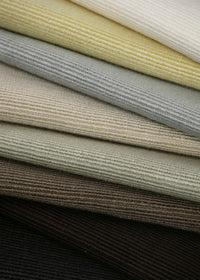 stacked pile of fabrics with a horizontal ribbed texture