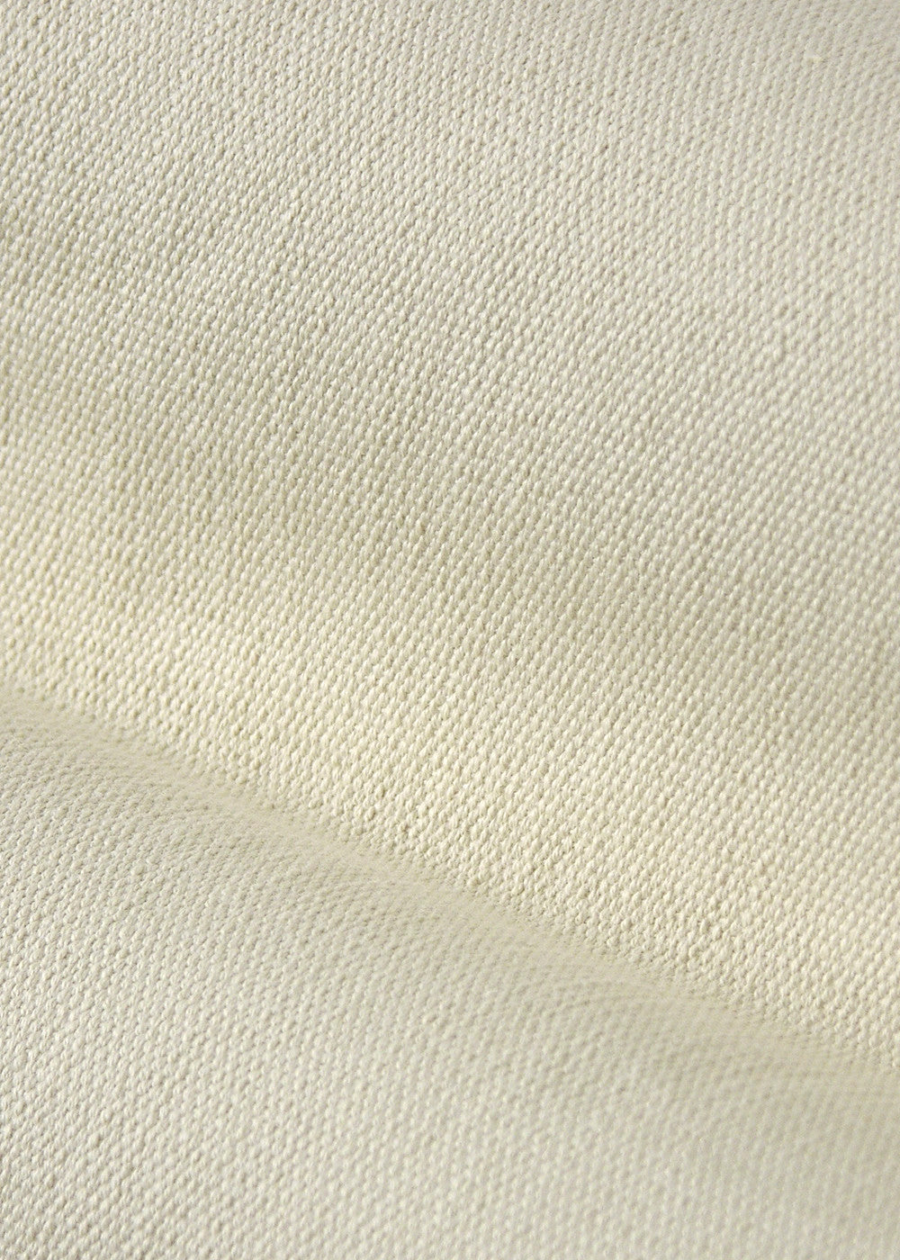 close up texture of a cream-colored fabric