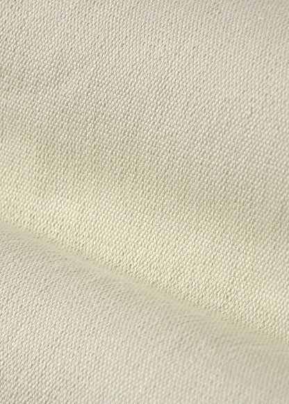close up texture of a cream-colored fabric