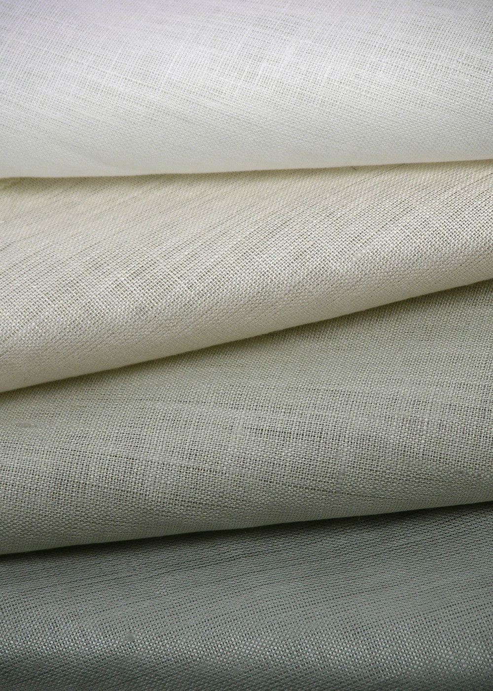 stack of sheer fabric with a luminous finish