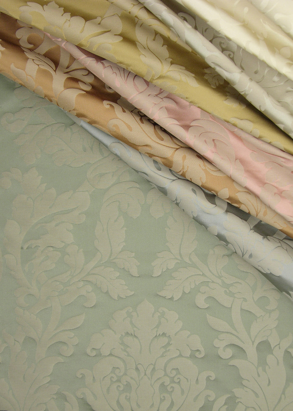 several colors of satin damask fabric