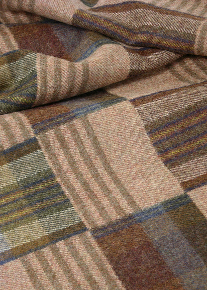 a crumpled wool fabric with a brown patchwork plaid pattern