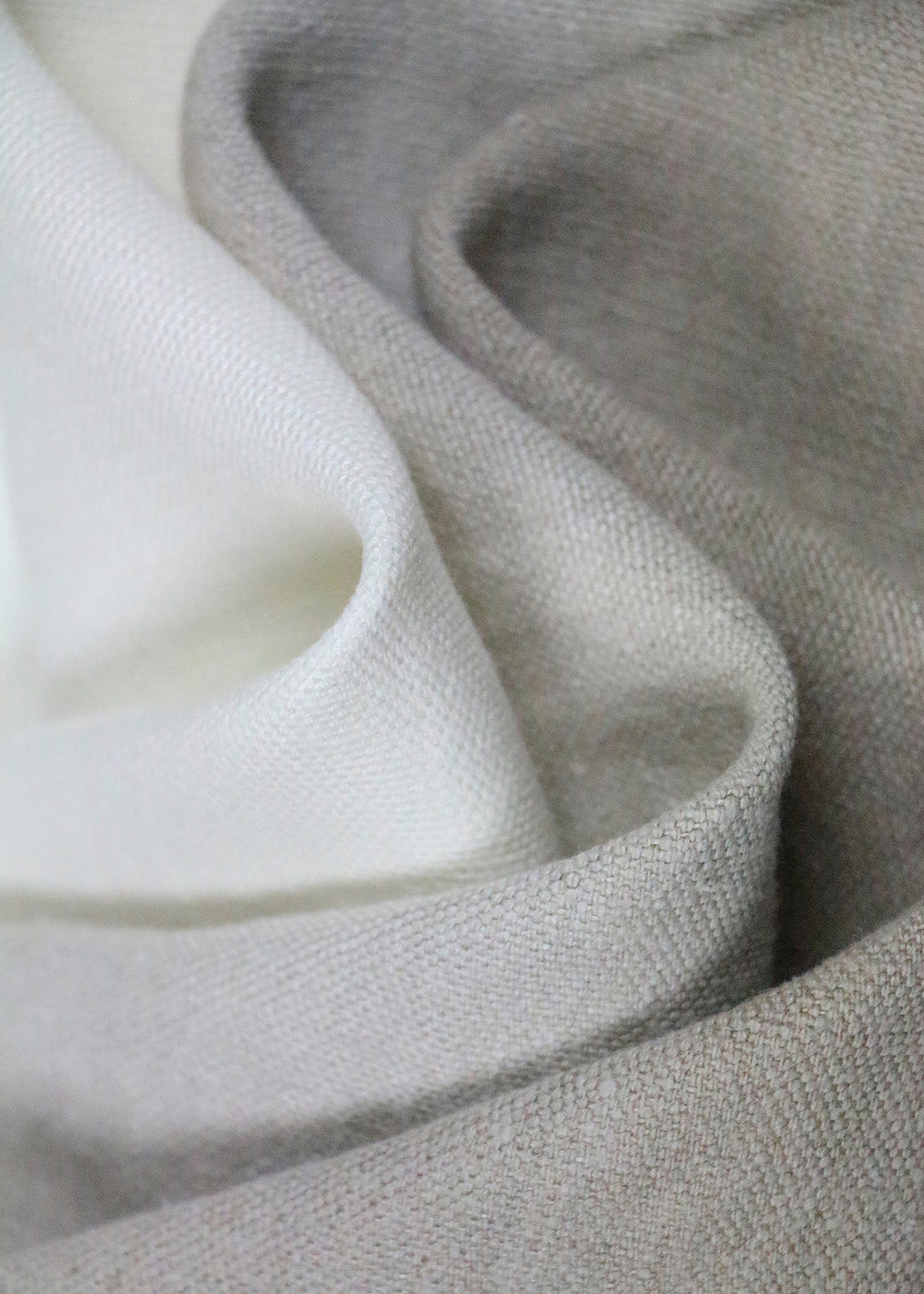 close up of linen upholstery fabrics in shades of grey