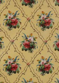chintz fabric printed with bouquets of flowers and a diamond shaped trellis on yellow background