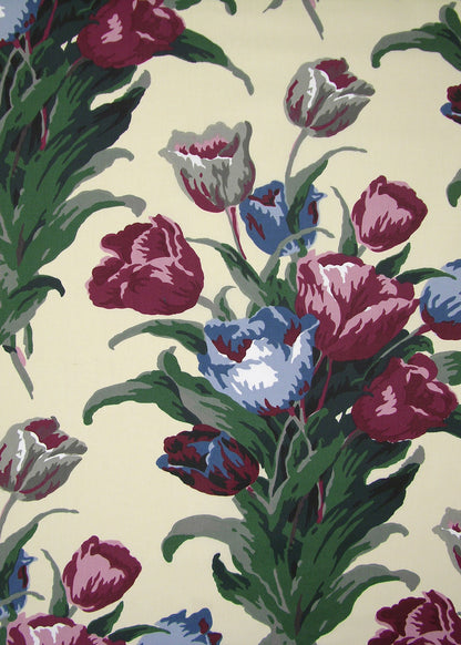 detail shot of butter yellow fabric with a floral print of magenta and blue tulips on top