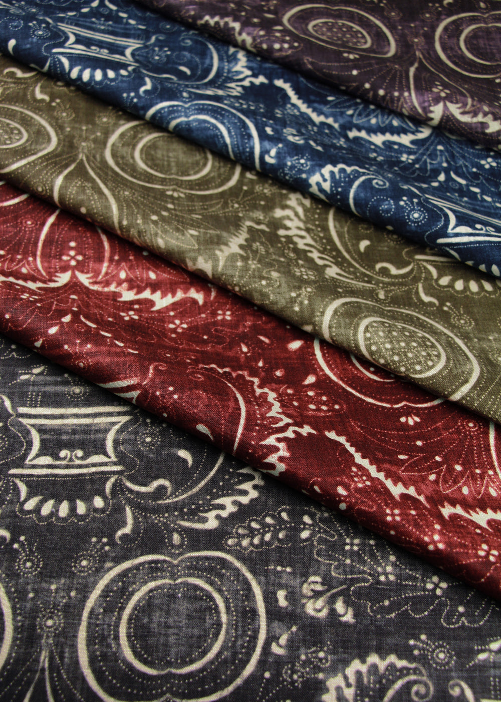 folded stacked fabric with swirling patterns