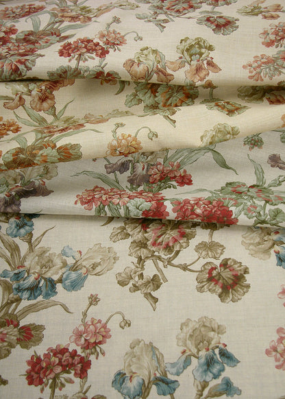 several natural linen fabrics printed with muted watercolor-effect flowers