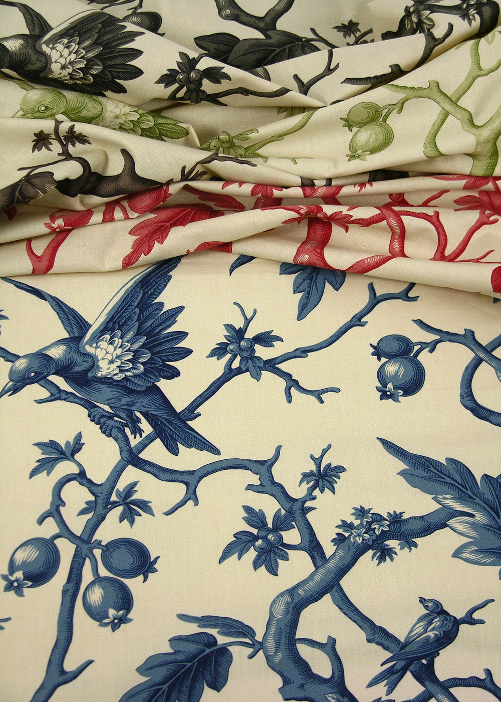 natural colored fabric printed with birds perched on branches and berries